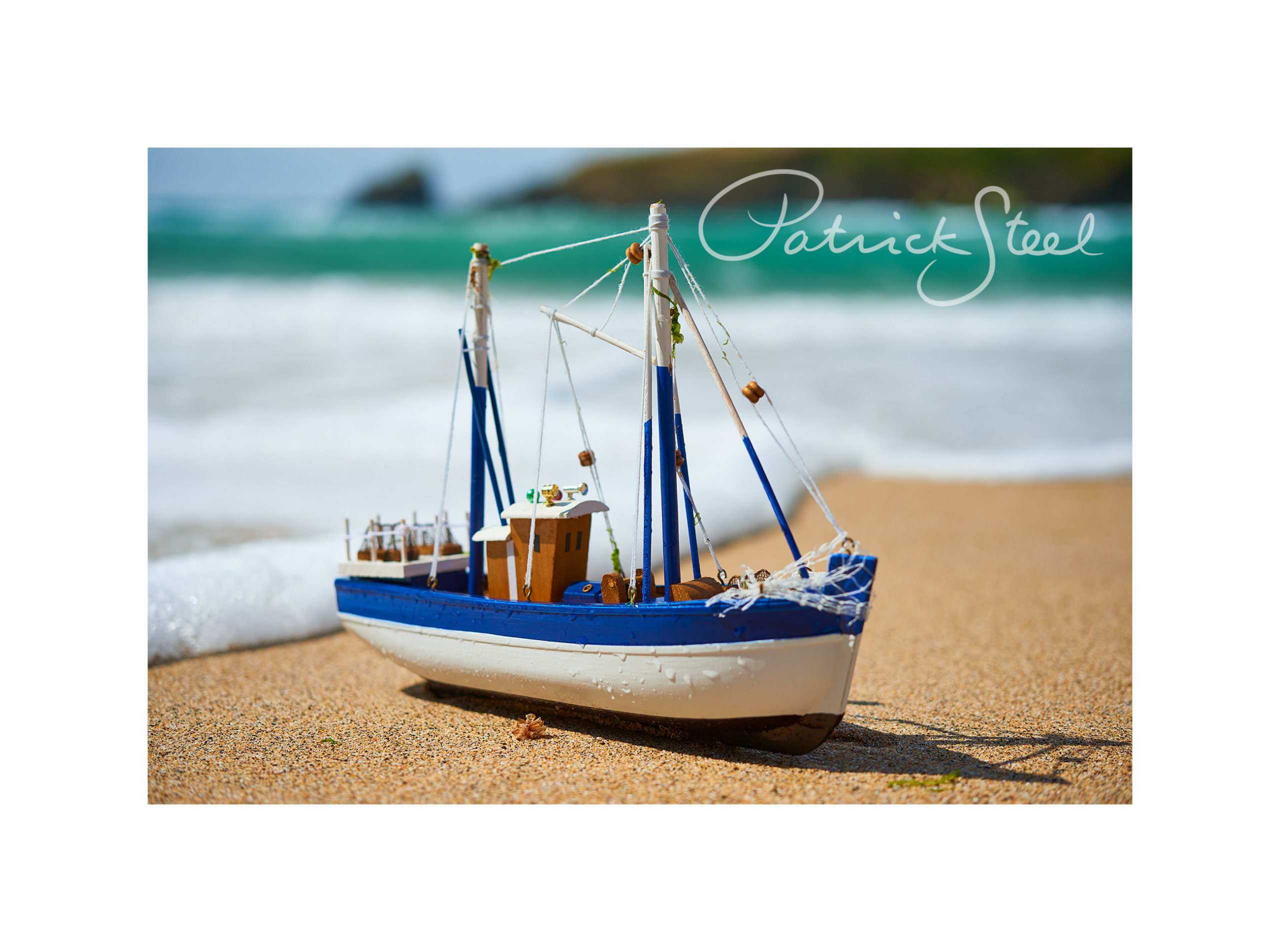 miniature fishing trawler on trevone beach cornwall by photographer patrick steel